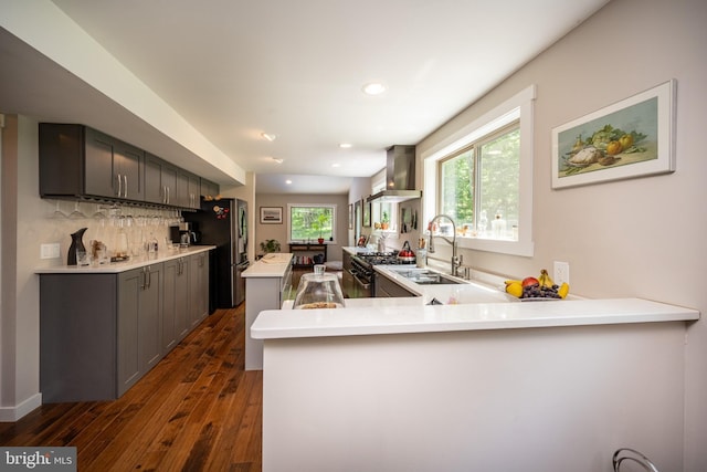 2250 Hoyes Run Rd, Mc Henry, MD 21541 - kitchen with wall chimney range hood, dark wood finished floors, a sink, light countertops, and a center island