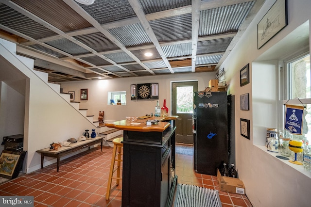 2250 Hoyes Run Rd, Mc Henry, MD 21541 - kitchen featuring freestanding refrigerator, tile patterned flooring, and a breakfast bar