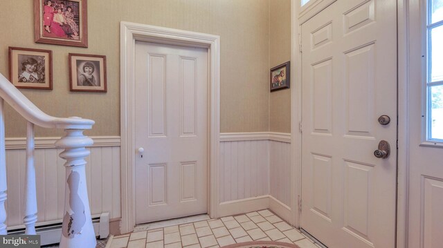 1607 Somers Point Rd, Egg Harbor Twp, NJ 08234 - entrance foyer with a baseboard radiator, a wainscoted wall, and a decorative wall