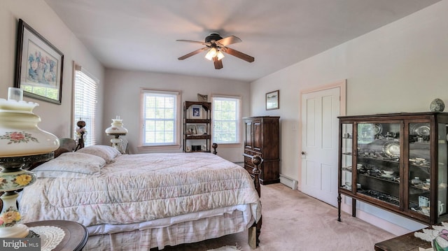 1607 Somers Point Rd, Egg Harbor Twp, NJ 08234 - bedroom with baseboard heating, light colored carpet, multiple windows, and a ceiling fan
