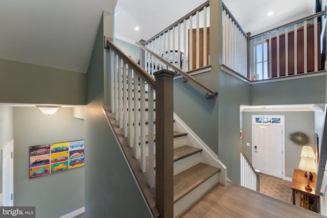 145 Center St S Unit 4, Vienna, VA 22180 - staircase featuring baseboards and a towering ceiling