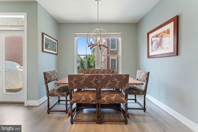 145 Center St S Unit 4, Vienna, VA 22180 - dining room featuring a chandelier, baseboards, and light wood-type flooring