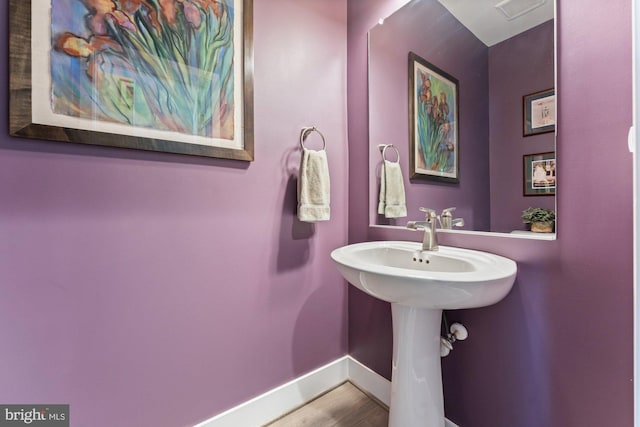 145 Center St S Unit 4, Vienna, VA 22180 - bathroom featuring baseboards and wood finished floors