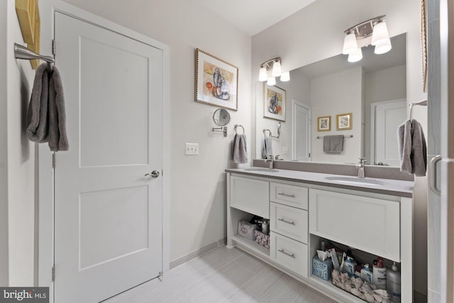 145 Center St S Unit 4, Vienna, VA 22180 - bathroom with double vanity, baseboards, and tile patterned floors