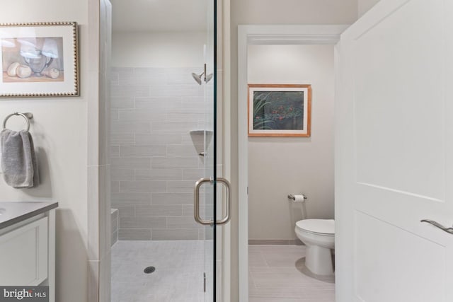 145 Center St S Unit 4, Vienna, VA 22180 - bathroom featuring a stall shower, toilet, vanity, tile patterned flooring, and baseboards