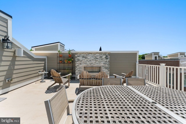 145 Center St S Unit 4, Vienna, VA 22180 - view of patio with an outdoor stone fireplace and outdoor dining area