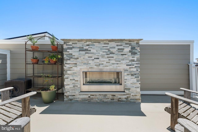 145 Center St S Unit 4, Vienna, VA 22180 - view of patio / terrace with a glass covered fireplace