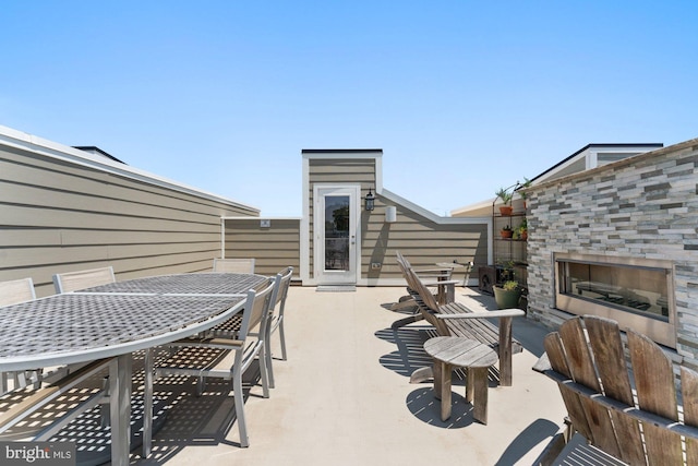 145 Center St S Unit 4, Vienna, VA 22180 - view of patio / terrace featuring an outdoor fireplace and outdoor dining space
