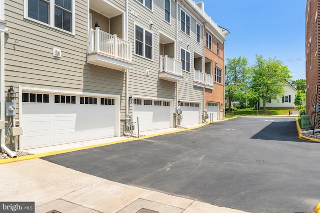 145 Center St S Unit 4, Vienna, VA 22180 - view of property featuring an attached garage and driveway