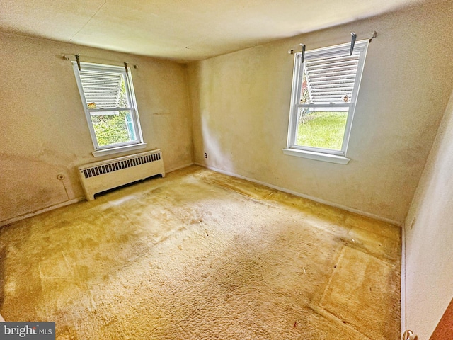 58 Washington Blvd, Norristown, PA 19403 - carpeted empty room featuring radiator and healthy amount of natural light