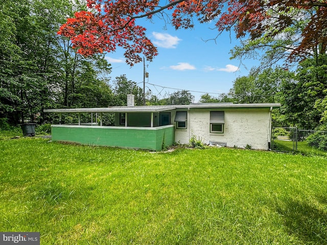 58 Washington Blvd, Norristown, PA 19403 - back of house with stucco siding and a chimney