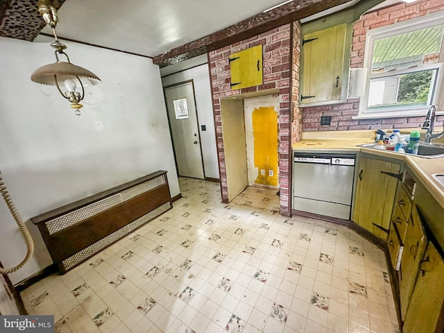 58 Washington Blvd, Norristown, PA 19403 - kitchen with dishwasher, a sink, light floors, light countertops, and brick wall