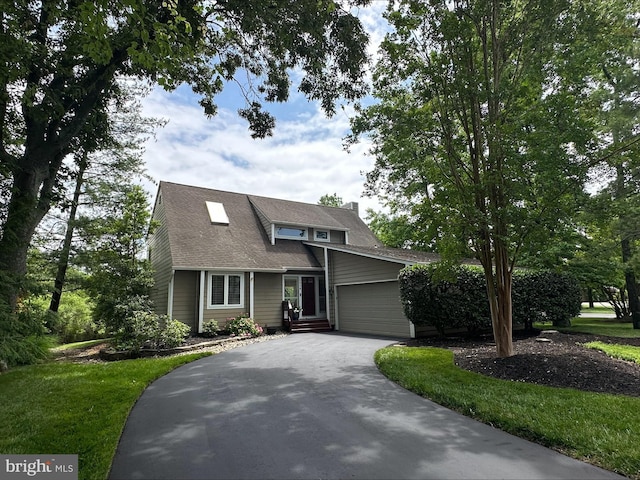 1028 Sandpiper Ln, Annapolis, MD 21403 - view of front of home with asphalt driveway, a garage, and a front lawn