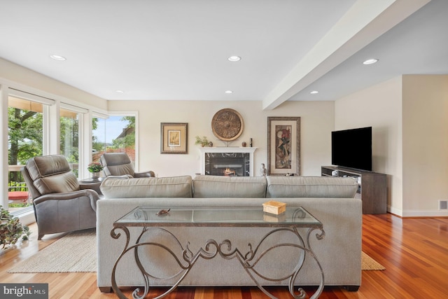 1028 Sandpiper Ln, Annapolis, MD 21403 - living room featuring a high end fireplace, wood finished floors, recessed lighting, and beam ceiling
