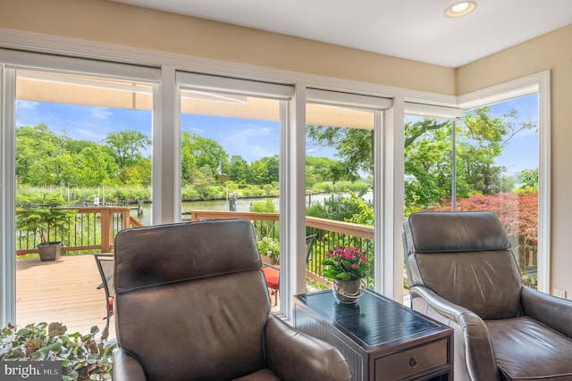 1028 Sandpiper Ln, Annapolis, MD 21403 - sunroom with a deck with water view, recessed lighting, and view of wooded area