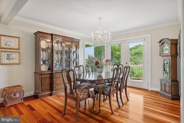 1028 Sandpiper Ln, Annapolis, MD 21403 - dining space with a chandelier, light wood-style floors, and crown molding