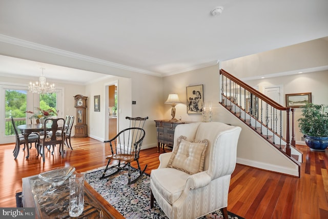 1028 Sandpiper Ln, Annapolis, MD 21403 - living room featuring a chandelier, wood finished floors, stairway, and ornamental molding