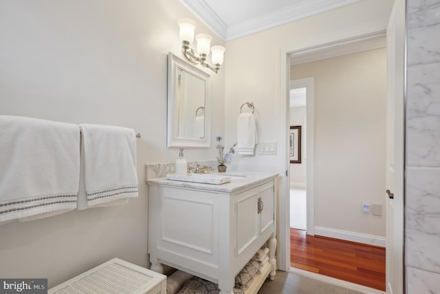 1028 Sandpiper Ln, Annapolis, MD 21403 - bathroom featuring ornamental molding, vanity, and wood finished floors