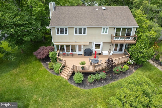1028 Sandpiper Ln, Annapolis, MD 21403 - back of property featuring a chimney, a deck, and a lawn
