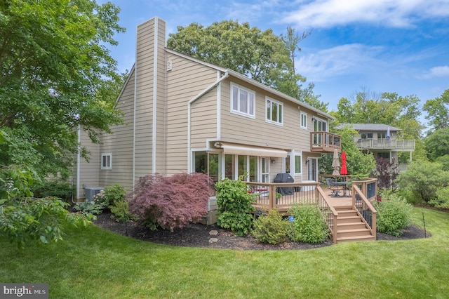 1028 Sandpiper Ln, Annapolis, MD 21403 - rear view of property with a lawn, a wooden deck, and a chimney