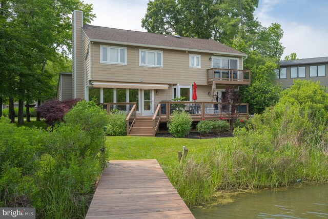 1028 Sandpiper Ln, Annapolis, MD 21403 - back of property with a chimney, a lawn, a deck with water view, and a balcony