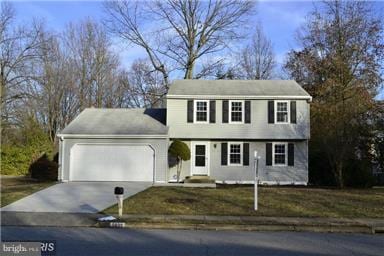 5039 Kenerson Dr, Fairfax, VA 22032 - colonial-style house featuring concrete driveway and an attached garage