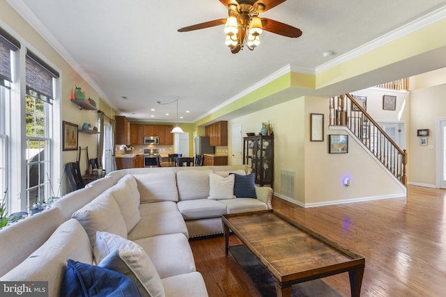 1207 Painted Fern Rd, Denton, MD 21629 - living room with stairs, wood finished floors, crown molding, a ceiling fan, and recessed lighting