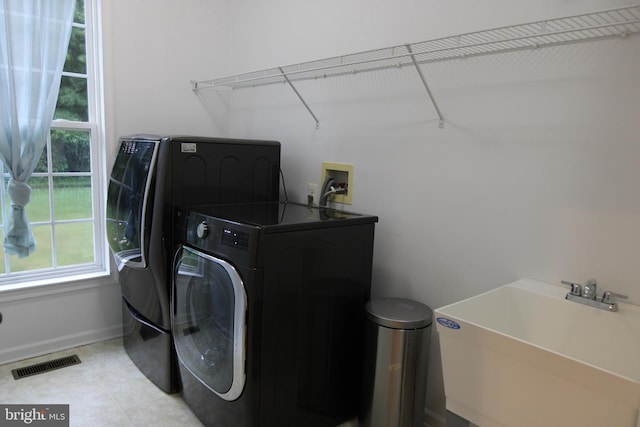 1207 Painted Fern Rd, Denton, MD 21629 - laundry area featuring separate washer and dryer and light tile patterned flooring