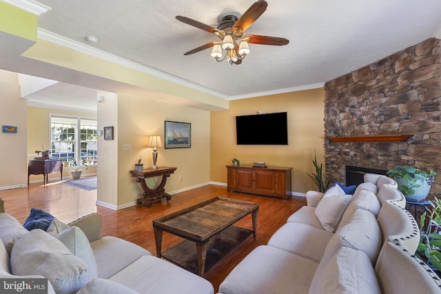 1207 Painted Fern Rd, Denton, MD 21629 - living room with a ceiling fan, wood finished floors, ornamental molding, and a fireplace