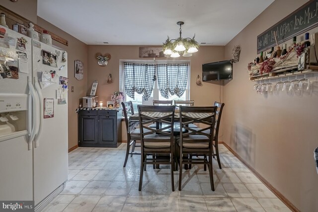 24 Cherry Grove Ln, Sicklerville, NJ 08081 - dining area featuring light floors, a chandelier, and baseboards