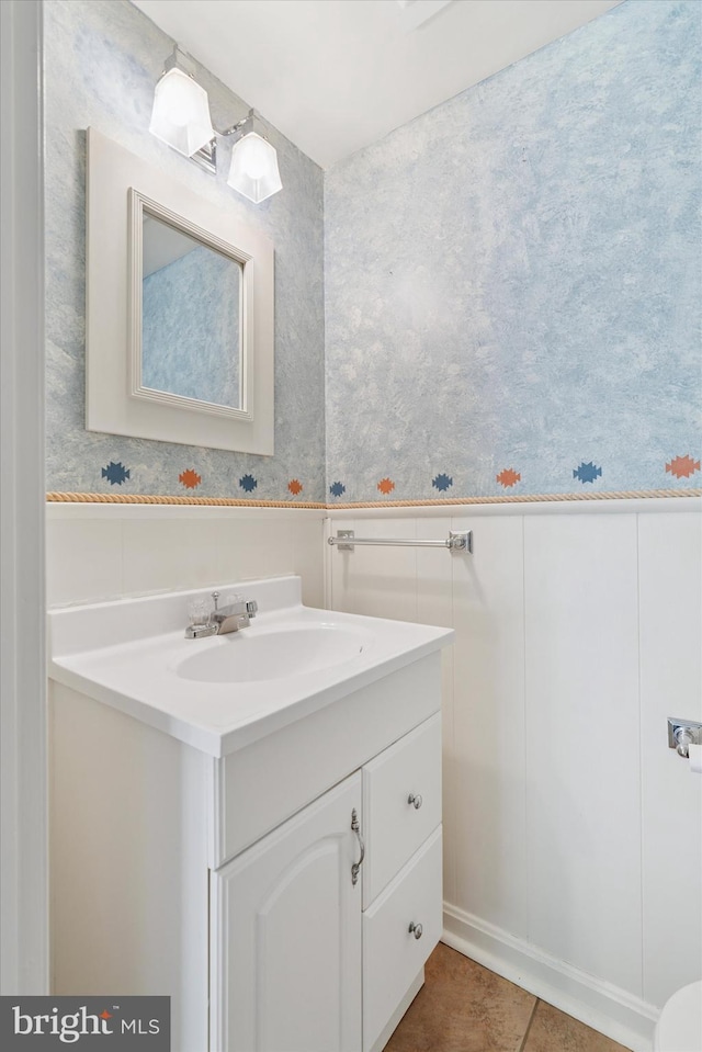 3447 Norwood Pl, Southampton, PA 18966 - bathroom with vanity, wallpapered walls, tile patterned flooring, and a wainscoted wall