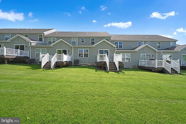 10 Hubbardton Ct, Sinking Spring, PA 19608 - back of property featuring central AC, a deck, and a yard