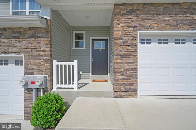 10 Hubbardton Ct, Sinking Spring, PA 19608 - view of exterior entry featuring stone siding and a garage