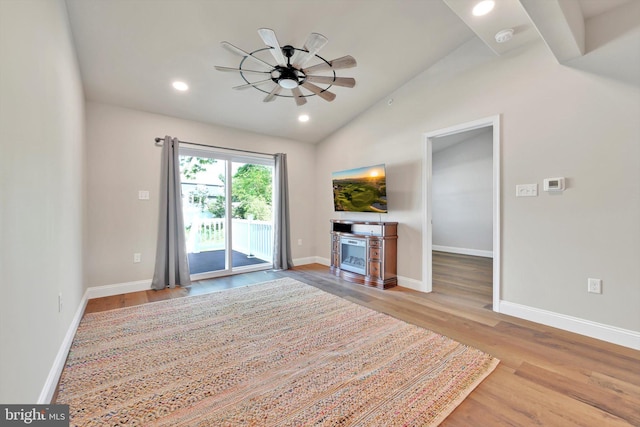 10 Hubbardton Ct, Sinking Spring, PA 19608 - unfurnished living room featuring vaulted ceiling, wood finished floors, ceiling fan, baseboards, and recessed lighting