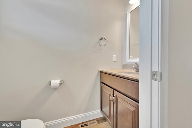 10 Hubbardton Ct, Sinking Spring, PA 19608 - half bath featuring vanity, toilet, and baseboards