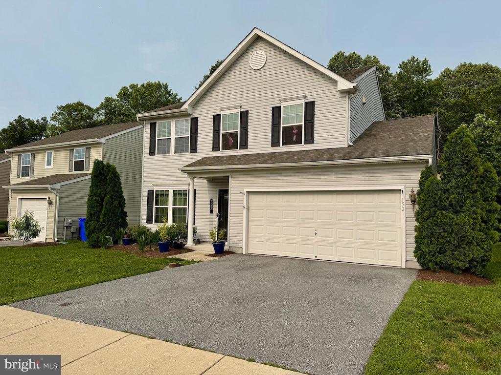 152 Bobbys Branch Rd Unit 68, Millsboro, DE 19966 - traditional-style home featuring asphalt driveway and a front yard