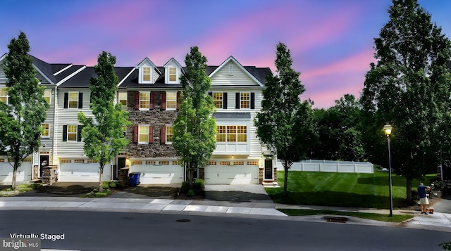 309 Latrobe Dr, Newark, DE 19702 - townhome / multi-family property with stone siding and an attached garage