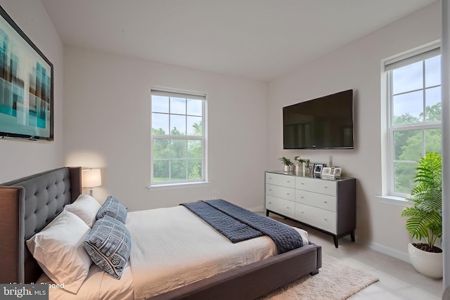 309 Latrobe Dr, Newark, DE 19702 - bedroom with multiple windows, baseboards, and carpet