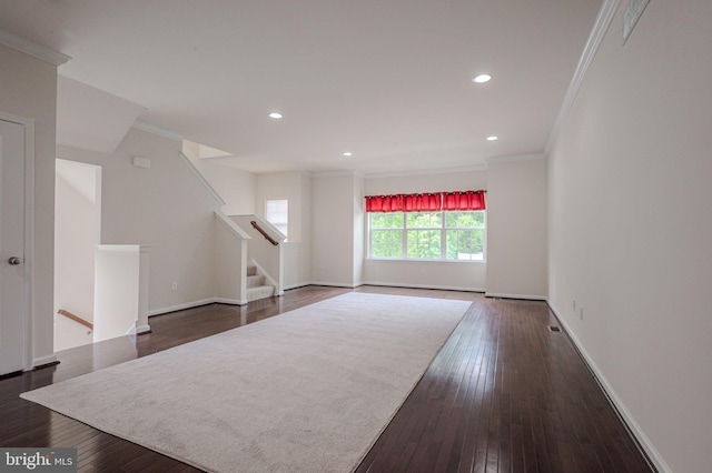 309 Latrobe Dr, Newark, DE 19702 - unfurnished living room with crown molding, dark wood-type flooring, baseboards, stairway, and recessed lighting