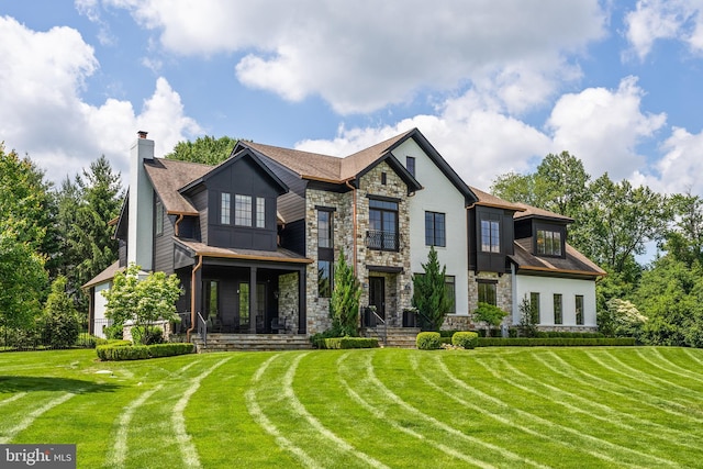 12220 Worthington Rd, Owings Mills, MD 21117 - view of front of property featuring stone siding, a front lawn, and a chimney