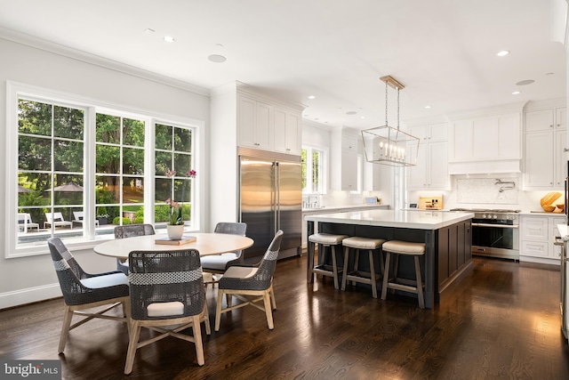 12220 Worthington Rd, Owings Mills, MD 21117 - dining room with a chandelier, healthy amount of natural light, dark wood-style floors, crown molding, and recessed lighting