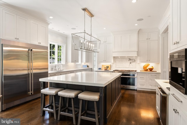12220 Worthington Rd, Owings Mills, MD 21117 - kitchen featuring stainless steel built in refrigerator, oven, white cabinets, recessed lighting, and crown molding