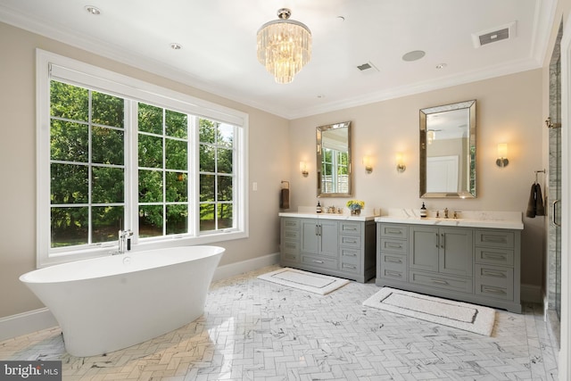 12220 Worthington Rd, Owings Mills, MD 21117 - bathroom featuring baseboards, vanity, a soaking tub, crown molding, and a chandelier