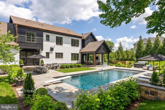 12220 Worthington Rd, Owings Mills, MD 21117 - view of swimming pool with outdoor lounge area, a patio area, a diving board, a gazebo, and grilling area