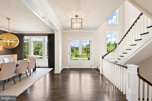 12220 Worthington Rd, Owings Mills, MD 21117 - entryway featuring a chandelier, dark wood finished floors, healthy amount of natural light, and crown molding