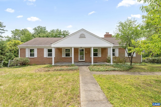 104 Chaucer Rd, Charlottesville, VA 22901 - single story home featuring brick siding, a front lawn, a porch, and a shingled roof