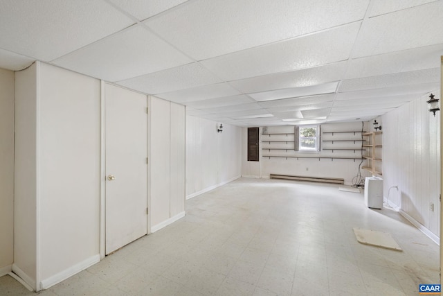 104 Chaucer Rd, Charlottesville, VA 22901 - basement featuring a baseboard heating unit, light floors, a drop ceiling, and baseboards