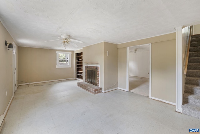 104 Chaucer Rd, Charlottesville, VA 22901 - unfurnished living room with a ceiling fan, stairway, a fireplace, tile patterned floors, and a textured ceiling