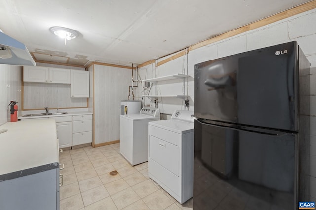 104 Chaucer Rd, Charlottesville, VA 22901 - washroom featuring separate washer and dryer, water heater, and light tile patterned flooring
