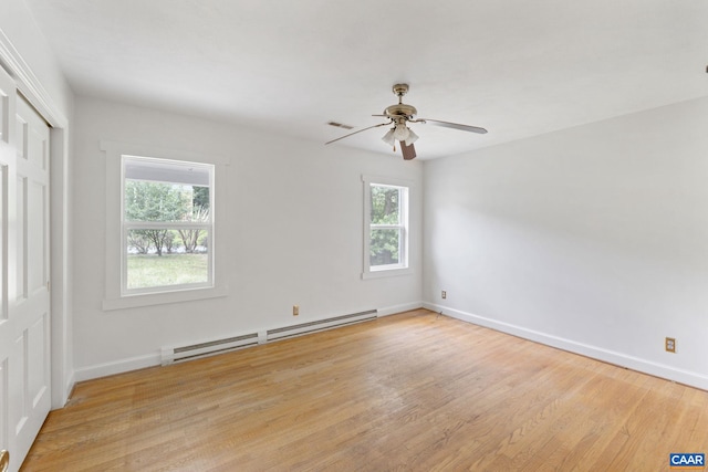 104 Chaucer Rd, Charlottesville, VA 22901 - unfurnished bedroom featuring baseboard heating, wood finished floors, baseboards, a closet, and ceiling fan